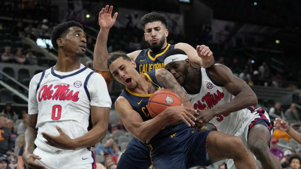 Dec 16, 2023; San Antonio, Texas, USA; California Golden Bears guard Jaylon Tyson (20) battles for the ball between Mississippi Rebels guards Brandon Murray (0) and Cole McGrath (30) at the Frost Bank Center. Mandatory Credit: Daniel Dunn-USA TODAY Sports